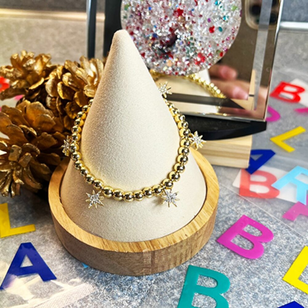 BaubleBar– NWT – “Pisa” Gold Tone Stretch Bracelet with Star Charms